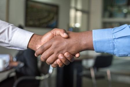 two people shaking hands